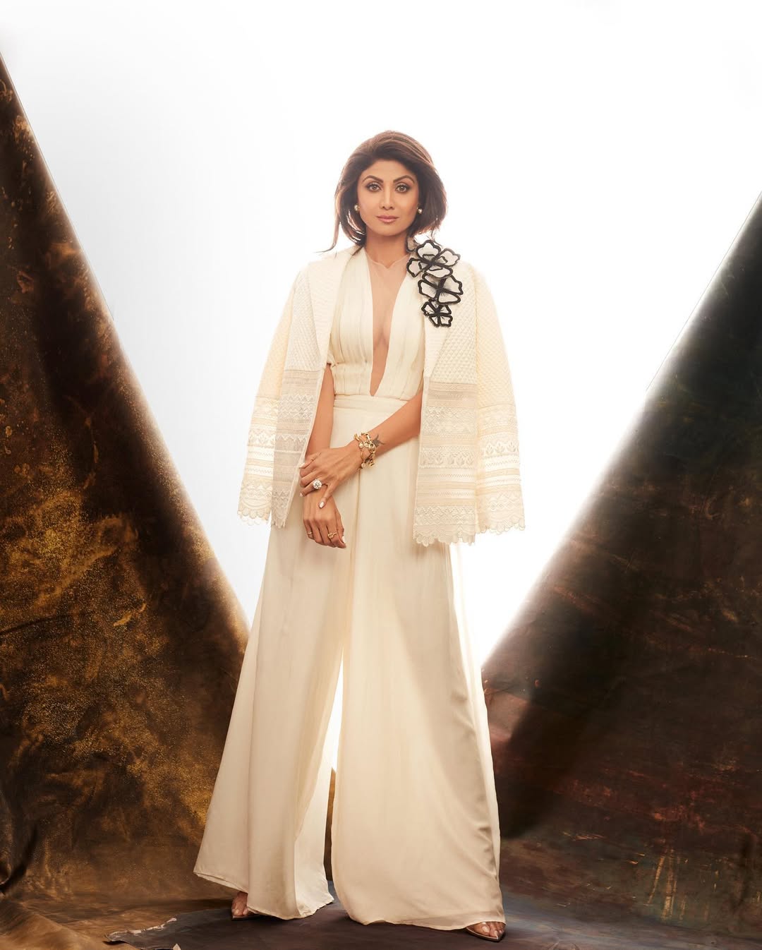 Ivory Quilted Blazer with White Pleated Jumpsuit